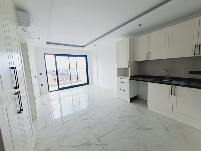 1+1 APARTMENT IN A NEW COMPLEX IN THE CENTER OF ALANYA