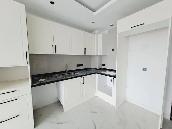 1+1 APARTMENT IN A NEW COMPLEX IN THE CENTER OF ALANYA