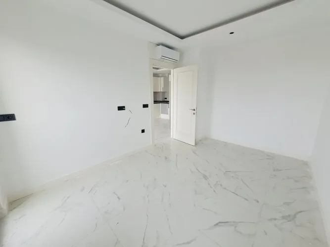 1+1 APARTMENT IN A NEW COMPLEX IN THE CENTER OF ALANYA