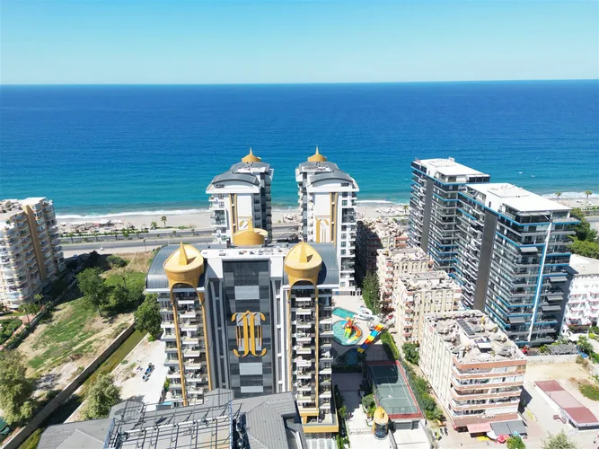 LUXURY 1+1 APARTMENT RIGHT ON THE BEACH IN ALANYA MAHMUTLAR.